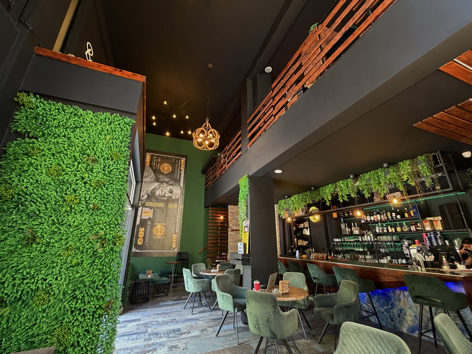 Casa Mokador interior — living green wall, bar and velvet lounge seating