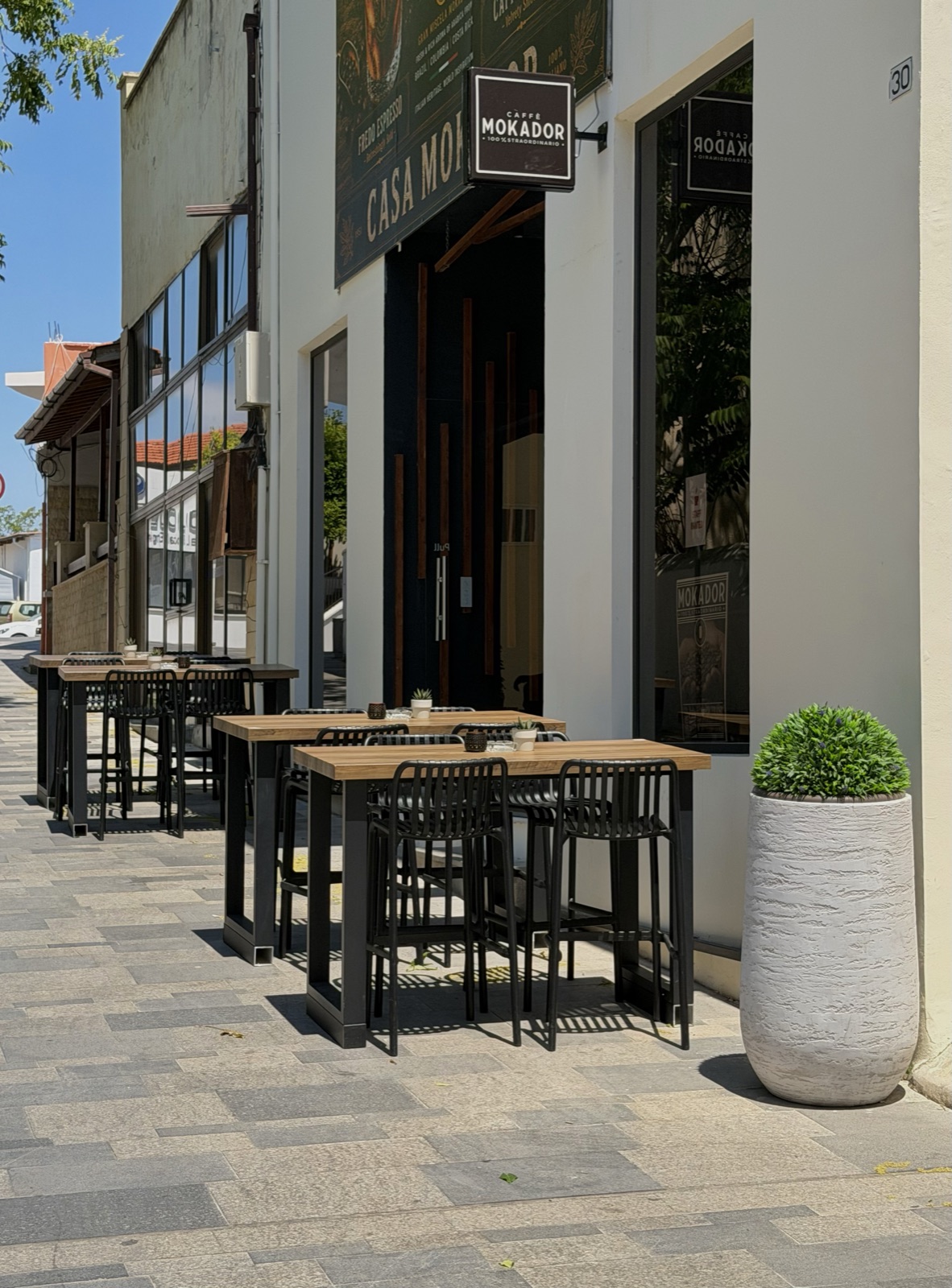 Casa Mokador storefront and pavement tables in Pafos